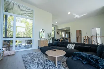 a living room with a couch and a table at Spa & Adventure - Chalet Valikas in Weedon-Centre