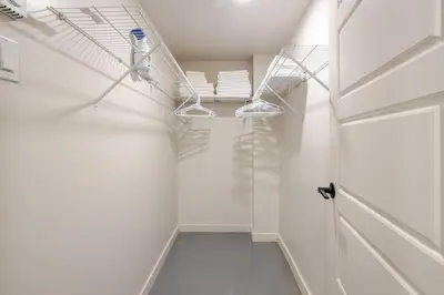 a hallway with white walls and white ceilings at Plateau Powerhouse 5BR and 2BA Apt in Montréal