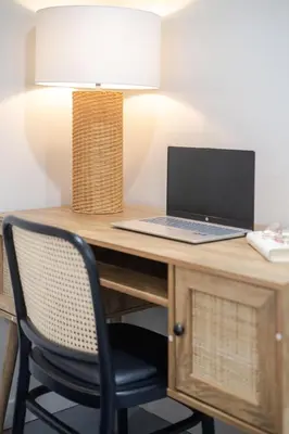 a desk with a laptop computer on top of it at Plateau Powerhouse 5BR and 2BA Apt in Montréal