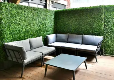 a patio with two chairs and a couch and a table at Yulux Old Montreal luxurious apartments in Montréal