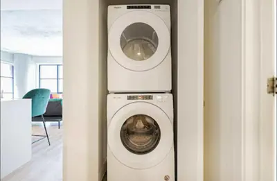 a washer and dryer in a room at Old Port Gem - Charming 2 bdr in Prime Location in Montréal
