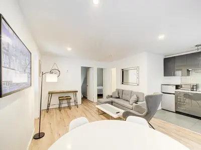 a living room with a couch and a table at Superbe 2 chambres à Griffintown in Montréal