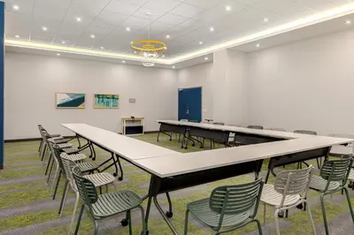 a conference room with a long table and chairs at Spark By Hilton Montreal Midtown in Montréal