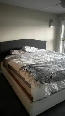 a large bed in a bedroom with at Cozy Riverside Home Retreat in Laval