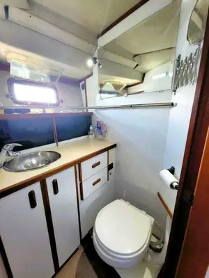 a small bathroom with a toilet and a sink at Chalet Boat in the heart of Montreal in Montréal