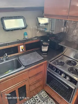 a small kitchen with a stove and a sink at Chalet Boat in the heart of Montreal in Montréal
