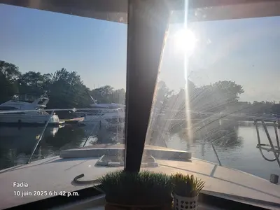 a window with a view of a marina with boats at Chalet Boat in the heart of Montreal in Montréal