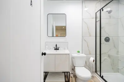a bathroom with a toilet and a sink and a shower at Room 1 - apartment 2 in a SHARED apartment in Montréal