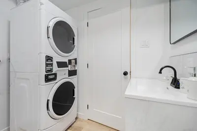 a white laundry room with a washer and dryer at Room 1 - apartment 2 in a SHARED apartment in Montréal