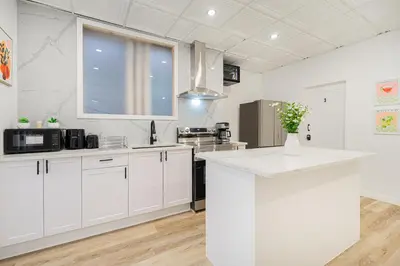 a kitchen with white cabinets and a white counter top at Room 1 - apartment 2 in a SHARED apartment in Montréal