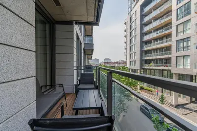 a balcony with a bench on a building at Modern Condo Old Town Montreal in Montréal