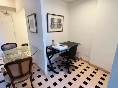 a dining room with a glass table and chairs at Modern City Living in the Golden Square Mile in Montréal