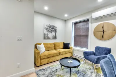 a living room with a couch and two chairs at Stylish Condo AC Wi-Fi Westmount Smart TV in Montréal