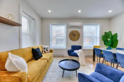 a living room with a couch and chairs and a table at Stylish Condo AC Wi-Fi Westmount Smart TV in Montréal