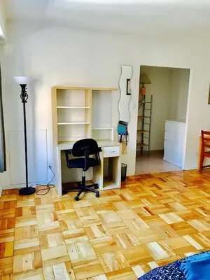 an office with a desk and a chair in a room at Modern Apartment City Living in the Golden Square Mile in Montréal