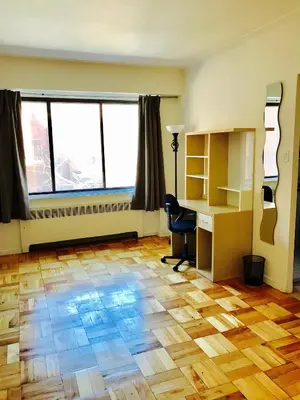 an office with a desk and a chair and windows at Modern Apartment City Living in the Golden Square Mile in Montréal