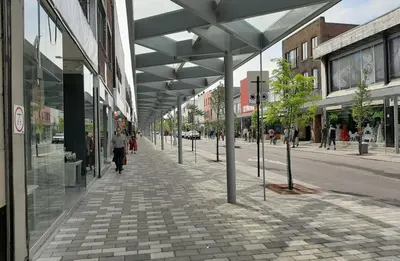 a city street with people walking on a sidewalk at Shope & Stay Central 7 in Montréal