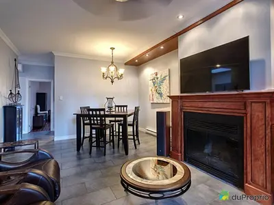 a living room with a fireplace and a dining room at 80m2 Vieux-Montreal, CHUM & metro 1 min, Parking in Montréal