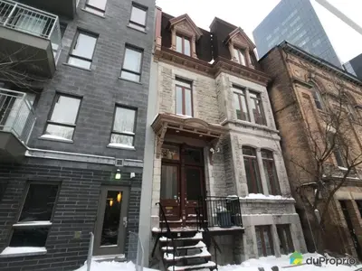a large building with snow in front of it at 80m2 Vieux-Montreal, CHUM & metro 1 min, Parking in Montréal