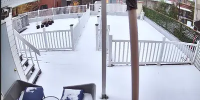a white staircase with snow on the ground at Shop & Stay Central 8 in Montréal