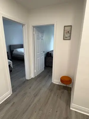 an empty room with a bed and a chair in it at Shop & Stay Central 6 in Montréal