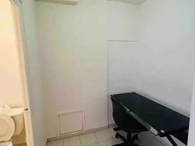 a bathroom with a ping pong table and a toilet at Modern City Apartment Living in the Golden Square Mile in Montréal