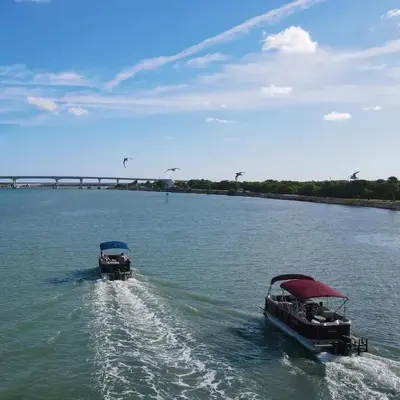 two boats in the water on a river at Private Boat Tour Montreal in Boucherville
