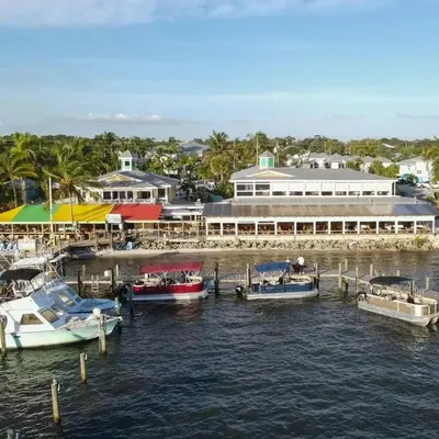 a group of boats docked at a marina at Private Boat Tour Montreal in Boucherville