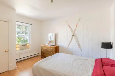 a bedroom with a large clock on the wall at Chez Flo in Trois-Rivières