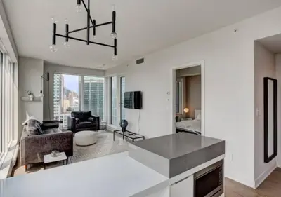 a living room with a couch and a table at TDC2 - 28th floor - 2 bd, 2 bth in Montréal