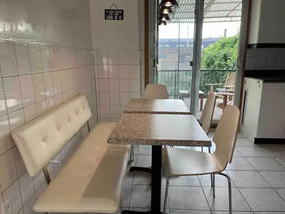 a dining room with a table and chairs in a room at Large Sunny 3 bedroom home in great neighbourhood in Montréal