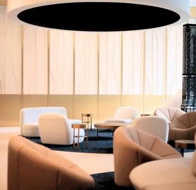 a waiting room with chairs and a large chandelier at Luxurious condo dowtown Montréal in Montréal