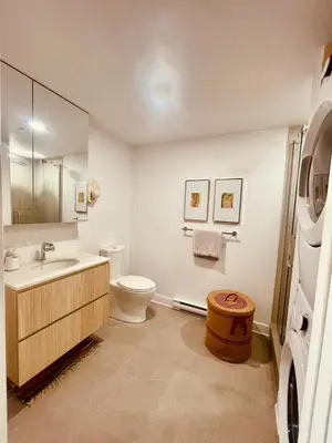 a bathroom with a toilet and a sink at Studio in Griffintown in Montréal