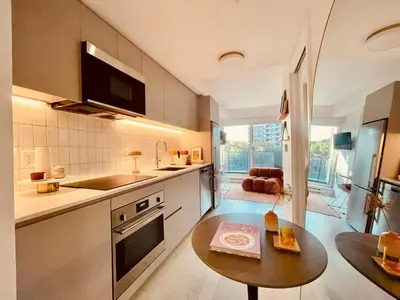 a kitchen with a table and a counter top at Studio in Griffintown in Montréal