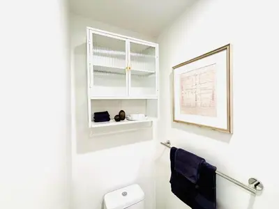 a bathroom with a toilet and a picture on the wall at Luxurious studio downtown Montreal in Montréal