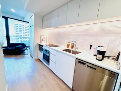 a kitchen with a sink and a counter top at Luxurious studio downtown Montreal in Montréal