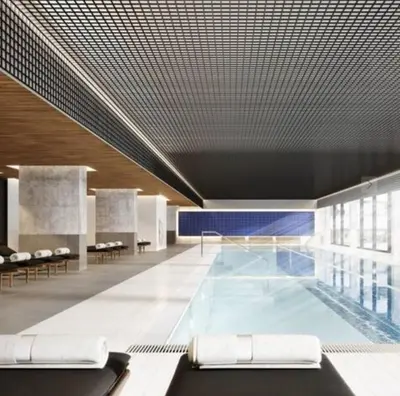 a swimming pool in a building with a ceiling at Luxurious studio downtown Montreal in Montréal