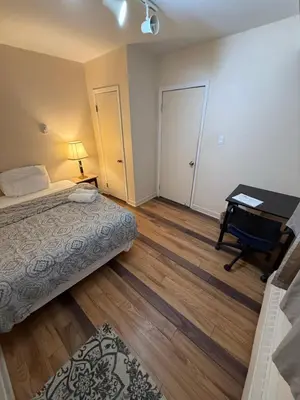a bedroom with a bed and a desk with a piano at Private Room Not Entire Apt Steps DownTown 18Mins Airport in Montréal