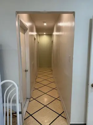 an empty hallway with a hallwaygue at Private Room Not Entire Apt Steps DownTown 18Mins Airport in Montréal