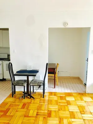 a dining room with a table and two chairs at Modern Apartment City Living in the Golden Square Mile in Montréal