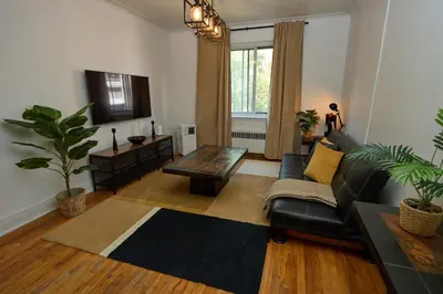 a living room with a couch and a coffee table at Van Horne Black VIP in Montréal