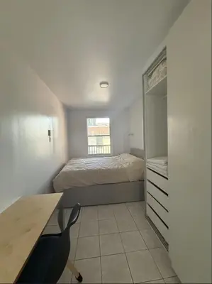 a bedroom with a bed and a desk and a bed at Cozy 1 bdrm apartment in the Village in Montréal