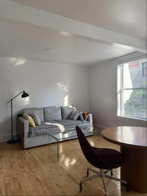 a living room with a couch and a table at Cozy 1 bdrm apartment in the Village in Montréal