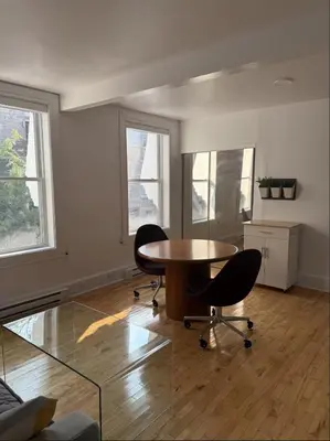 an empty room with a table and two chairs at Cozy 1 bdrm apartment in the Village in Montréal
