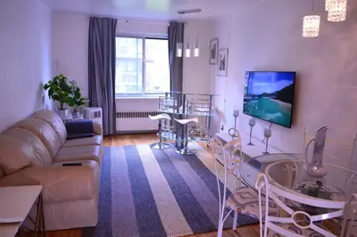 a living room with a couch and a table at Van Horne Sweet Celebration in Montréal