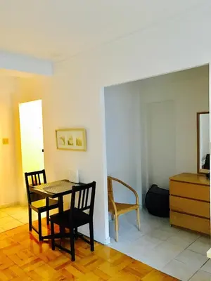a dining room with a table and two chairs at Modern City Studio Living in the Golden Square Mile in Montréal