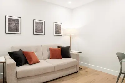 a living room with a couch with pillows on it at SD5 Harmony sur le plateau in Montréal