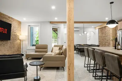 a living room with a kitchen and a dining room at SD5 Harmony sur le plateau in Montréal
