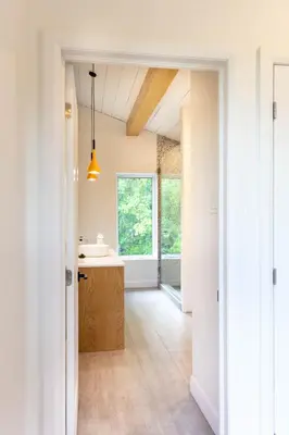 a bathroom with a sink and a window at By the river - Le 91 in Frelighsburg