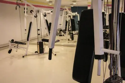 a snowboard is hanging from a rack in a gym at Studio, balcony, pool view, sauna in Montréal